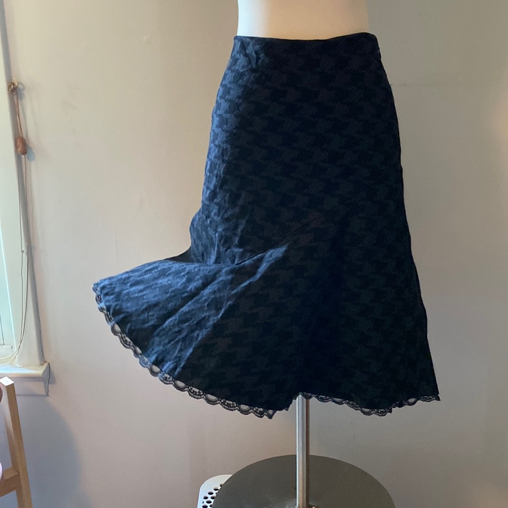 Gently worn patterned skirt with lace ruffle hem